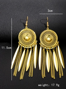 Detail view of gold bohemian tassel earrings with dimensions 11.5cm by 3cm size