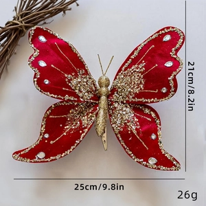 Detail of a red velvet butterfly with gold glitter and silver rhinestones, 25cm x 21cm size