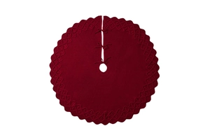 Detailed macro view of the knitted texture and wavy edges of this large red Xmas tree skirt
