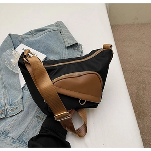 Large capacity canvas shoulder bag in black and brown contrast design for daily commute