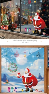 Christmas window decals showing Santa and tree stickers on storefront glass display