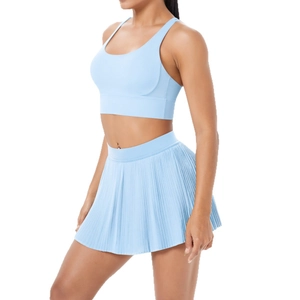 Light blue two-piece yoga set with racerback sports bra and pleated tennis skirt