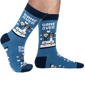 Detailed knit texture of blue cotton socks with wedding pixel art and Game Over text
