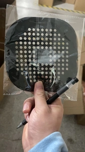 Macro view of black square silicone drain cover with suction cups for hair filtering