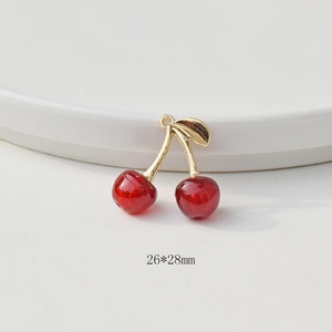 Detail shot of 26x28mm 3D red cherry pendant with gold leaf for DIY jewelry making