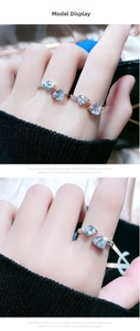 Detail of adjustable ring with double heart-shaped blue zircons and side micro-inlays