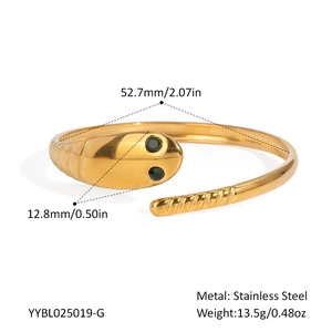 Detailed view of snake head bracelet with green gemstone eyes and dimensions in stainless steel