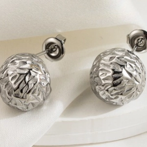 Minimalist silver spherical stud earrings with textured crumpled metal surface design