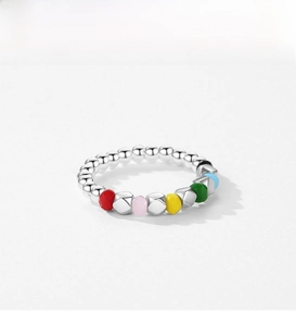 Macro shot of S925 sterling silver beaded ring with five colorful faceted gemstones