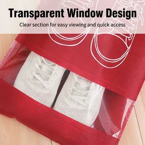 Red non-woven shoe storage bag with transparent window on a light wood floor