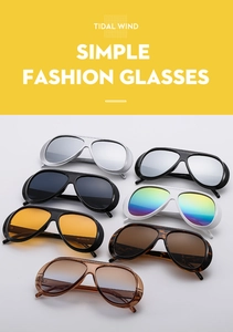 Close-up of stylish oversized pilot sunglasses with protective side shields and diverse lens colors