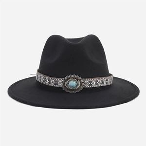 Detail of black wool fedora featuring an ethnic ribbon with turquoise stone embellishment