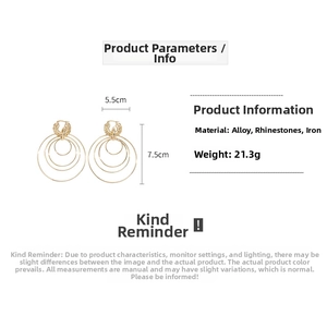 Detail view of large gold multi-layer hoop earrings with rhinestones and dimensions