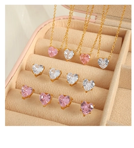 Macro shot of heart-shaped zircon jewelry set in box with pink and white gems