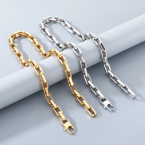 Detail of 9mm bold square link chain necklaces in gold and silver finish with lobster clasps
