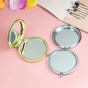 Polished silver and gold metal folding mirrors with dual-sided reflective glass lenses