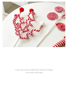 Detail of red and white spiral plush ball picks for DIY Christmas village and tree decor