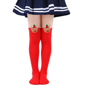 Close-up of kids red over-the-knee Christmas socks with a 3D reindeer plush mascot decor