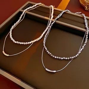 Minimalist double-layer irregular metal and pearl necklace with golden finish for women