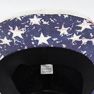 Detail of the 100% paper material label and American flag star print on cowboy hat brim