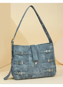 Detail view of retro blue PU shoulder bag featuring multi-strap design and gold buckles