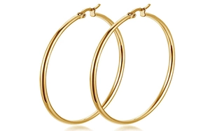 Detailed view of large gold-plated stainless steel hoop earrings with polished finish