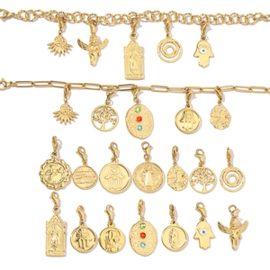 Detailed set of gold plated titanium steel charms with Hamsa and Tree of Life pendants