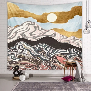 Detail shot of abstract mountain tapestry with golden sun and flowing textures on white wall