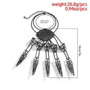 Detailed view of Gothic black hand harness with hollow filigree and finger armor rings