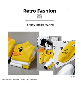 Detail of yellow duck embroidery on cotton ankle socks in yellow, white and black colors