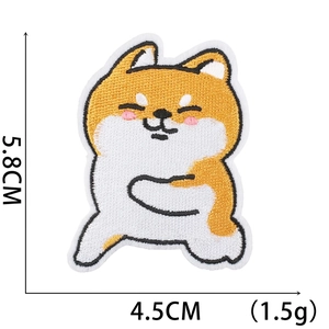 Close-up of Shiba Inu cartoon embroidery patch measuring 5.8cm x 4.5cm with size markers
