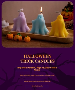 Close-up of cute ghost scented candles in purple, blue and yellow for Halloween decor