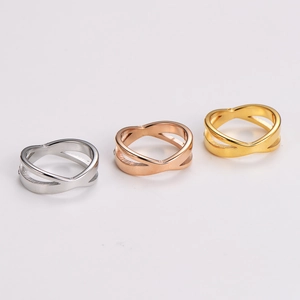 Three-piece stainless steel X-cross rings set in silver, gold, and rose gold finishes