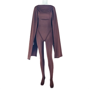 Detail view of dark brown skin-tight jumpsuit with matching cape attachment on mannequin