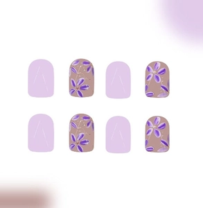 Detailed view of short square purple press-on nails with elegant floral patterns