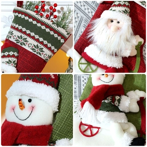 Detail of 3D Santa and snowman dolls on festive knit Christmas stockings with snowflake patterns