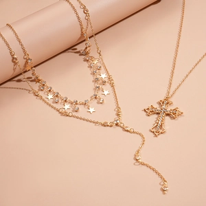 Three-piece gold layered necklace set with sparkling star and cross rhinestone pendants