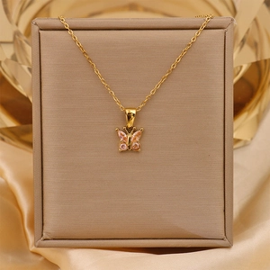 Detailed close-up of a 18K gold-plated titanium necklace with pink zircon butterfly pendant