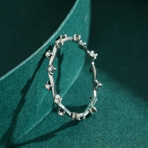 Irregular micro-pave S925 sterling silver ring with small diamonds on green velvet