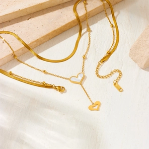 Double-layered gold titanium steel necklace with white shell heart pendant and Y-chain fringe
