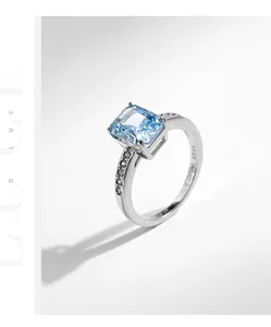 Detail of S925 sterling silver ring with rectangular blue zircon and side diamonds