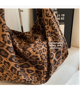 Detailed view of the soft leopard print fabric on this large fashion tote bag