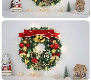 Detail of Christmas wreaths with golden stars, red bows, bells, and warm LED lights