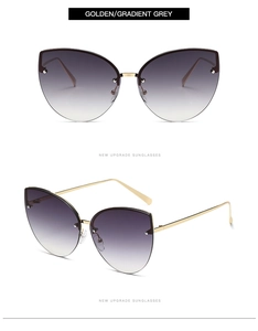 Detail view of cat-eye sunglasses featuring metal temples and gradient grey lenses