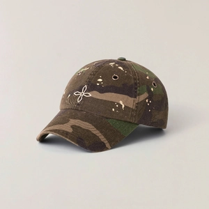 Distressed dark forest camouflage baseball cap with white embroidery and paint splatter