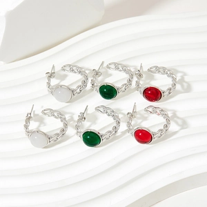 Three pairs of vintage C-shape earrings with colorful glass stones in silver chain texture
