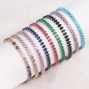 Detail view of multicolored marquise cut cubic zirconia tennis bracelets on white display