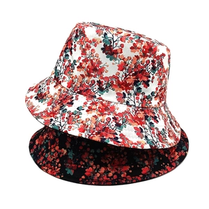 Reversible floral bucket hat for sun protection in black and white botanical prints