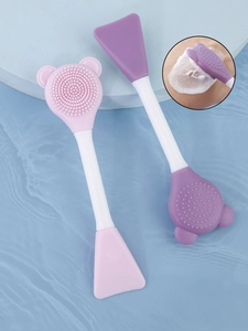 Close-up of double-headed silicone facial brush for cleansing and mask application