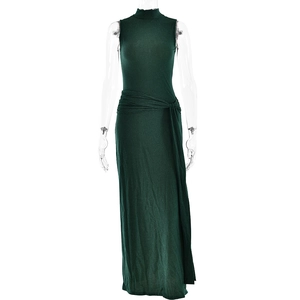 Detail of dark green shimmering dress with sleeveless high neck and waist twist detail